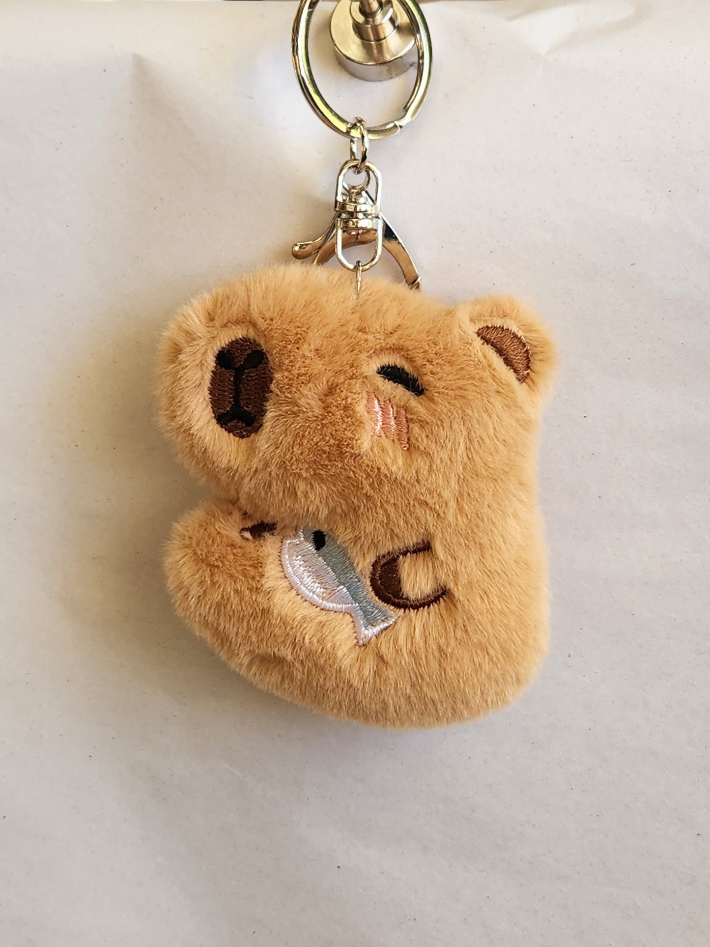 Capybara Holding A Fish Keychain