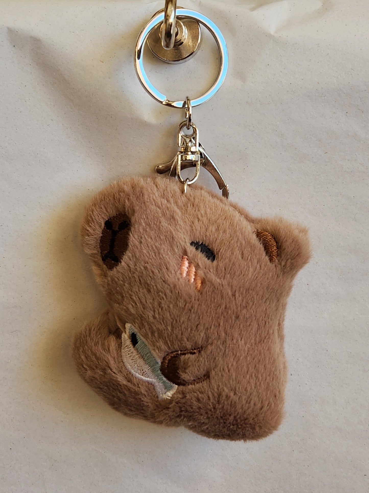 Capybara Holding A Fish Keychain