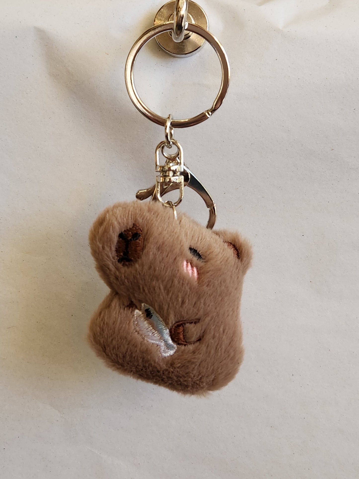 Capybara Holding A Fish Keychain