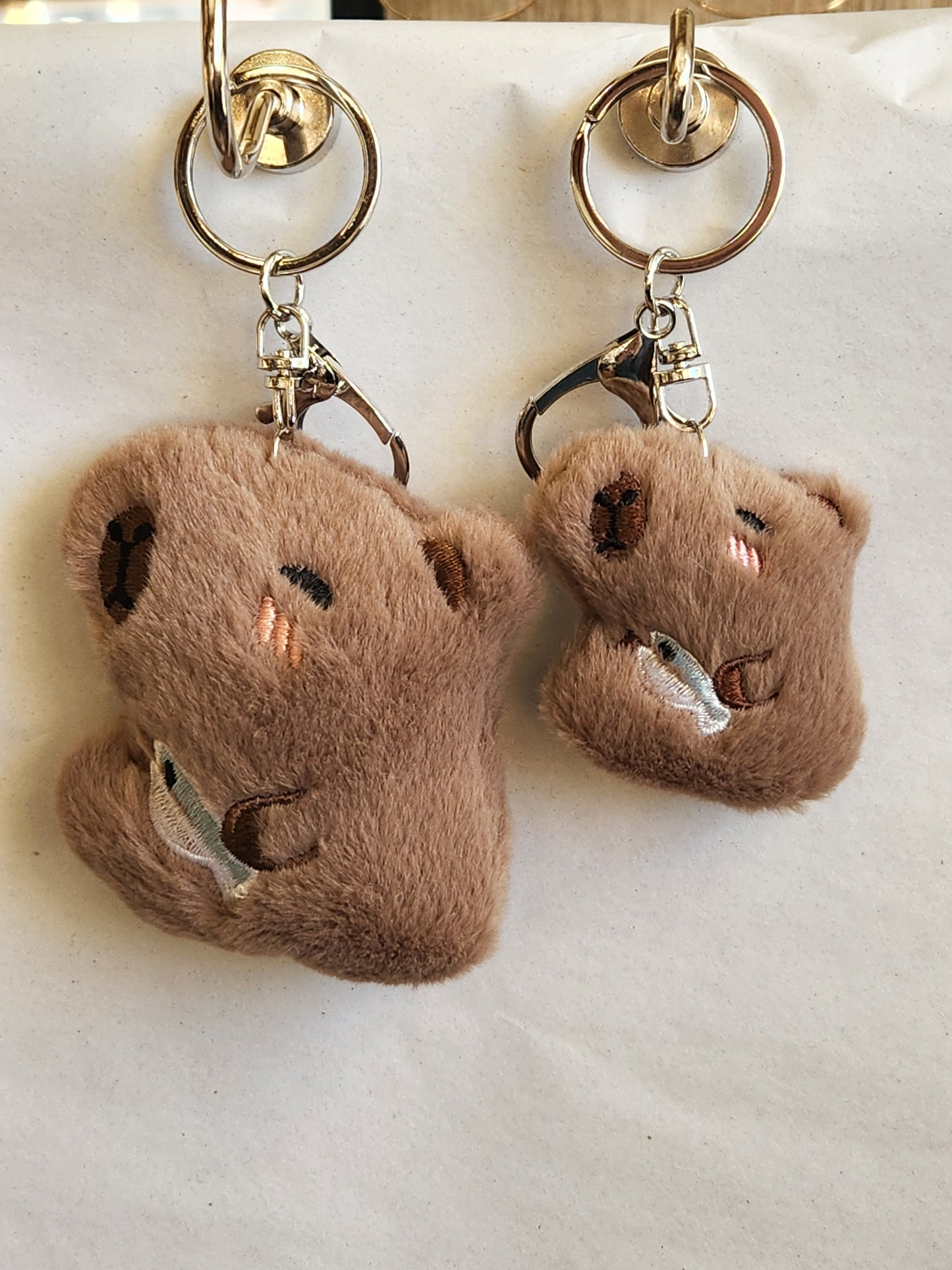 Capybara Holding A Fish Keychain