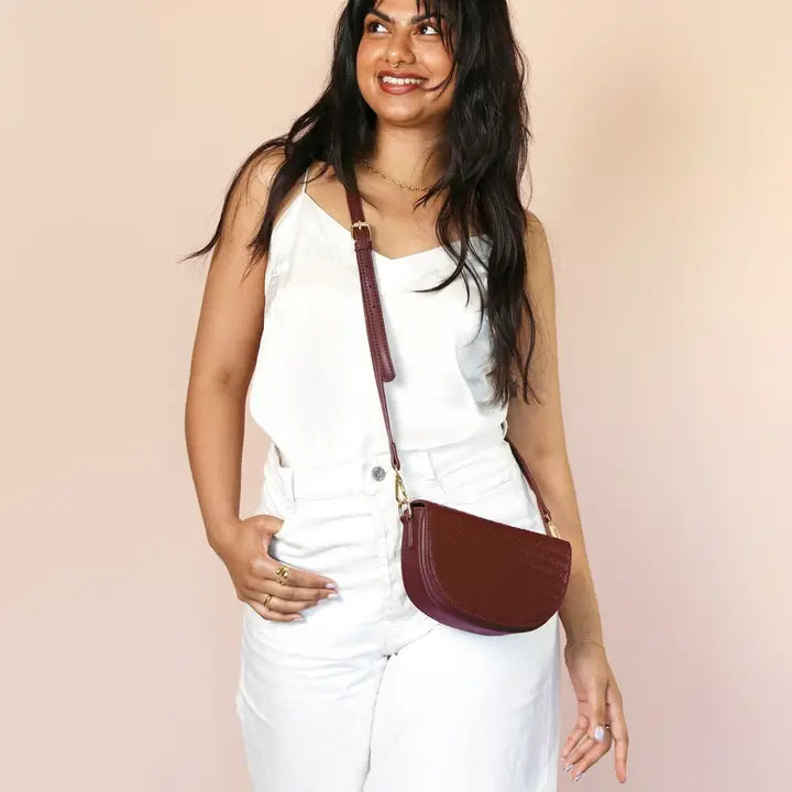Woven Vegan Leather Half Moon Crossbody Bag in Burgundy