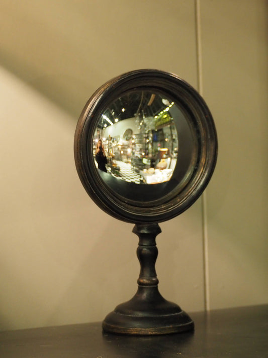 Small convex mirror on stand