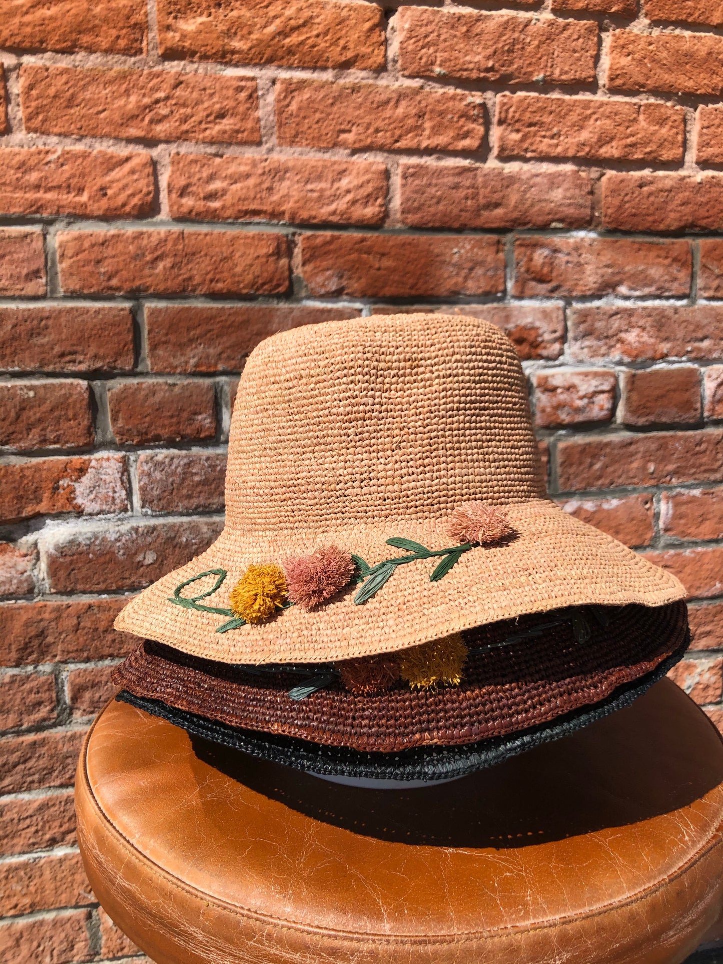 Straw Hat with Pom Pom Flowers
